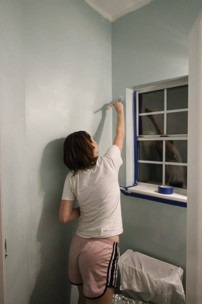 me painting a wall around a window